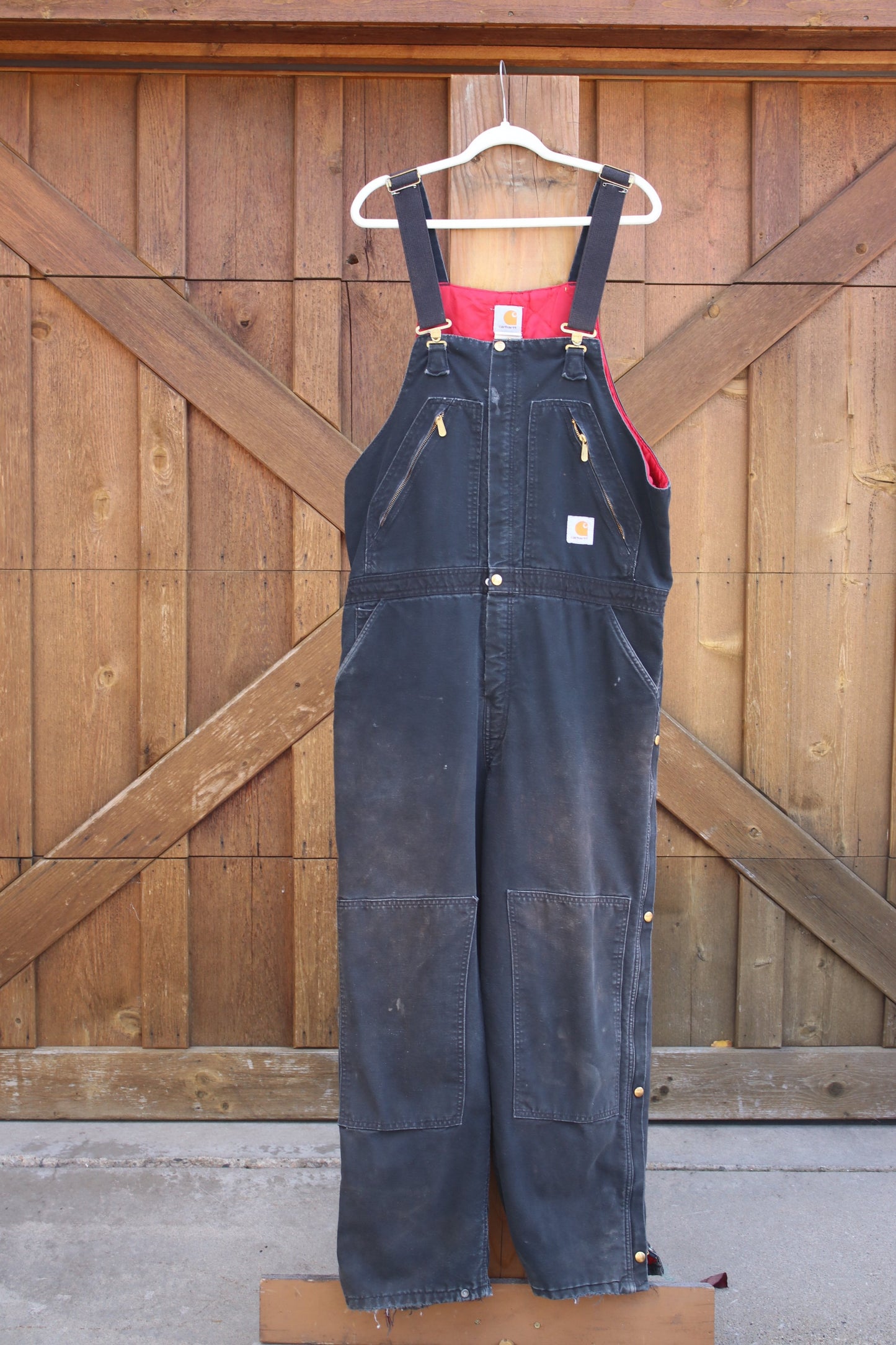Vintage Carhartt Insulated Duck Overalls – Black Canvas, Red Quilted Lining, Heavy-Duty Workwear