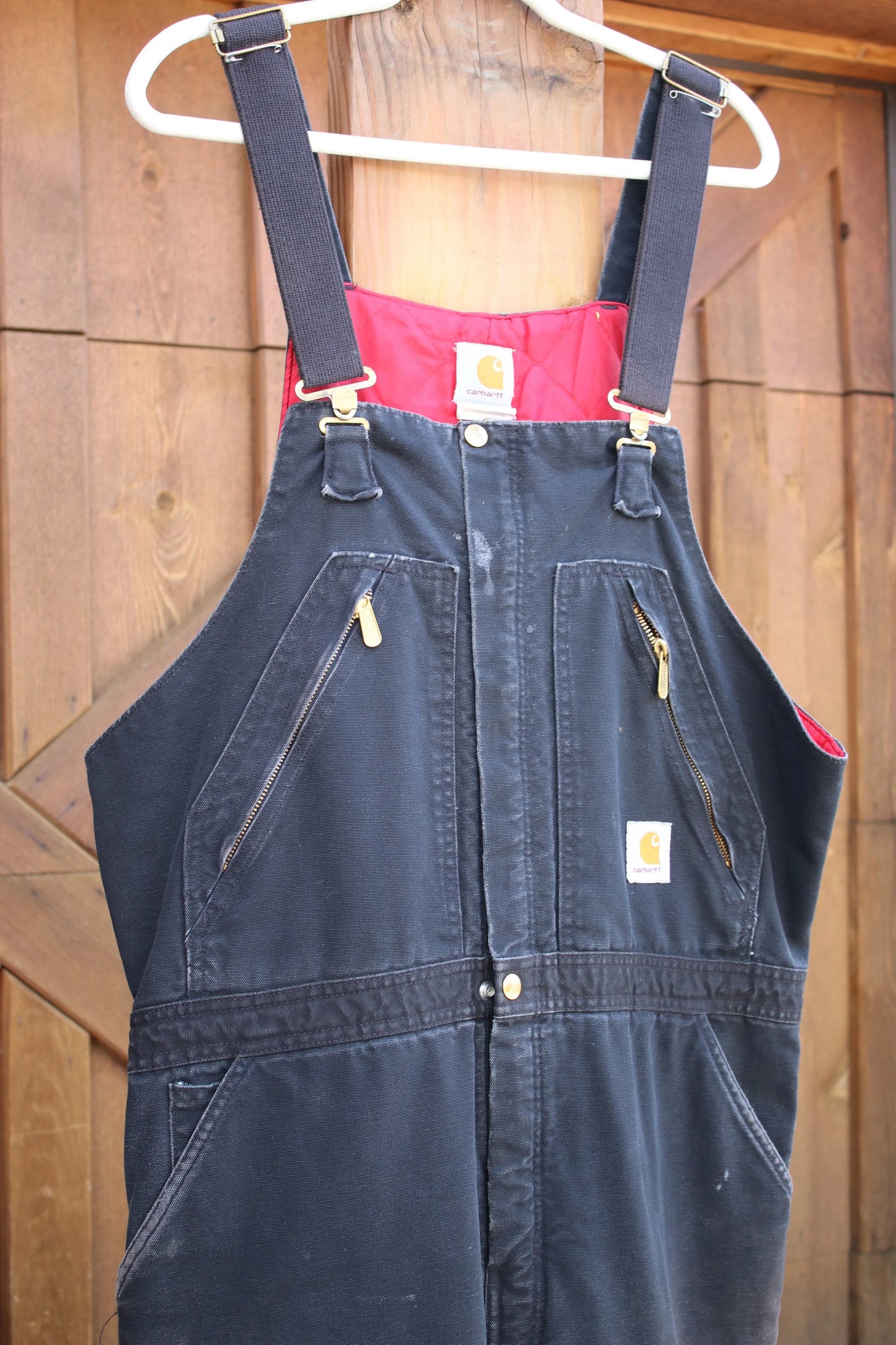 Vintage Carhartt Insulated Duck Overalls – Black Canvas, Red Quilted Lining, Heavy-Duty Workwear