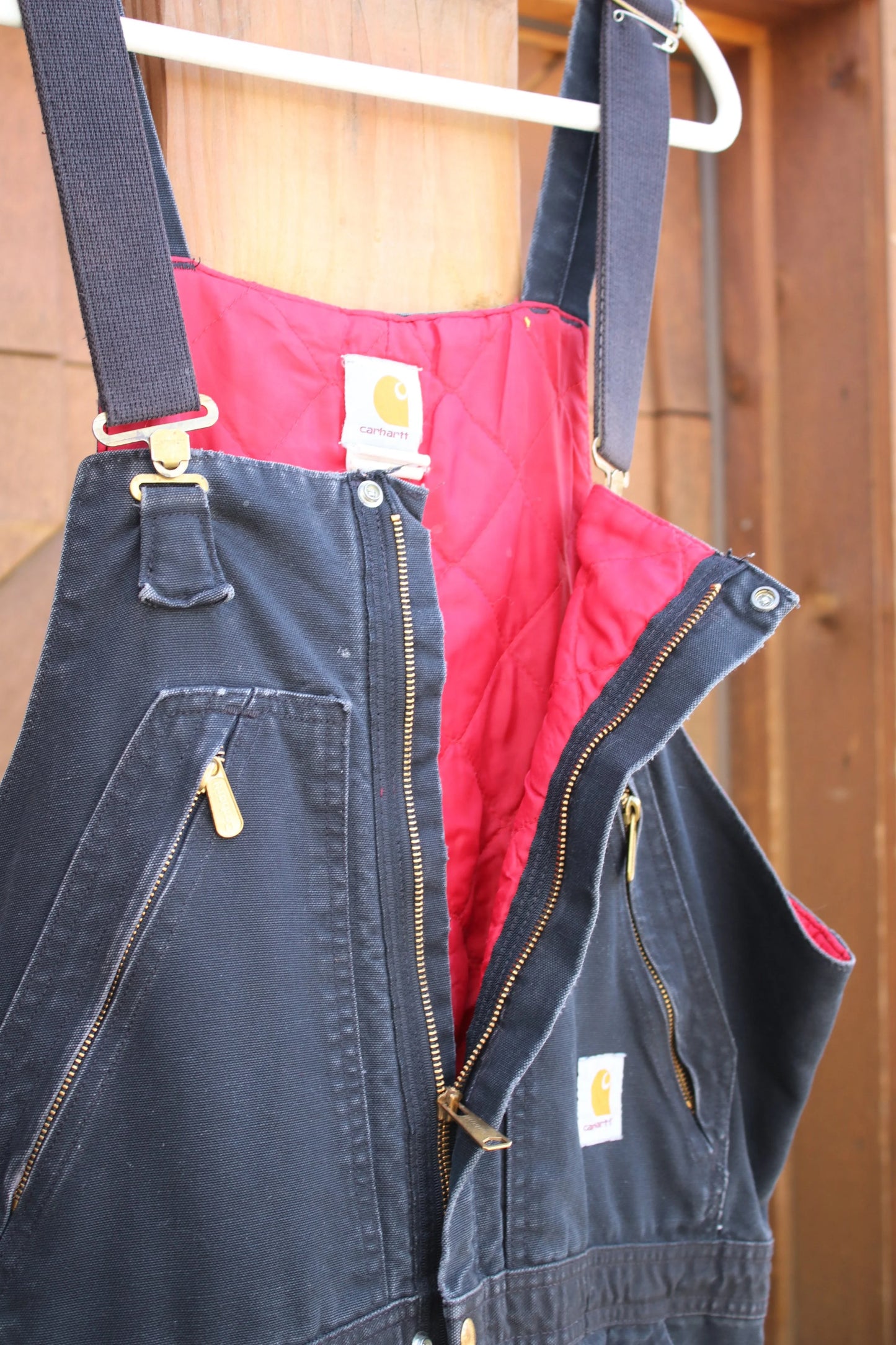 Vintage Carhartt Insulated Duck Overalls – Black Canvas, Red Quilted Lining, Heavy-Duty Workwear