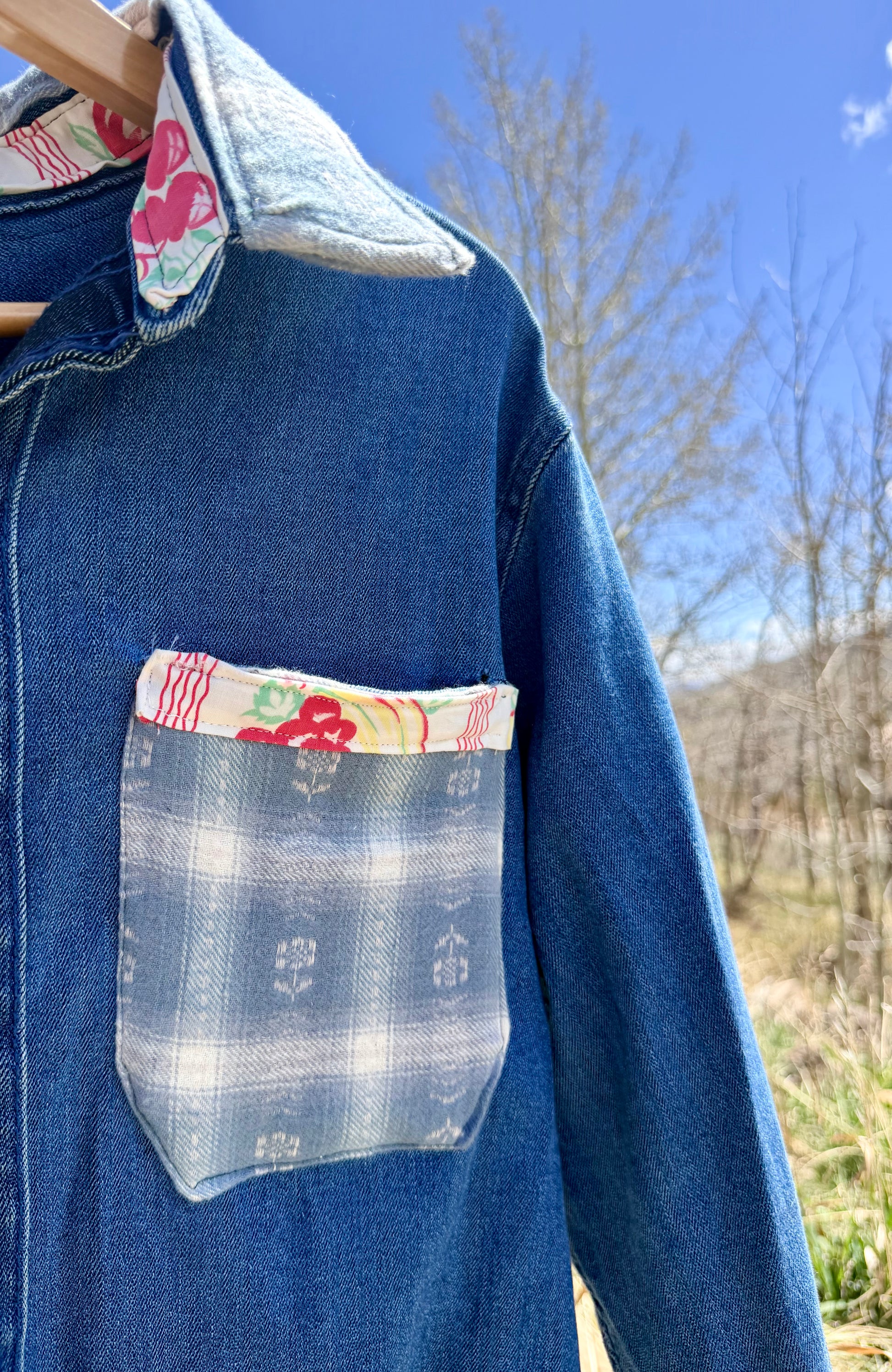 Blue denim workwear shirt with floral and southwestern pocket