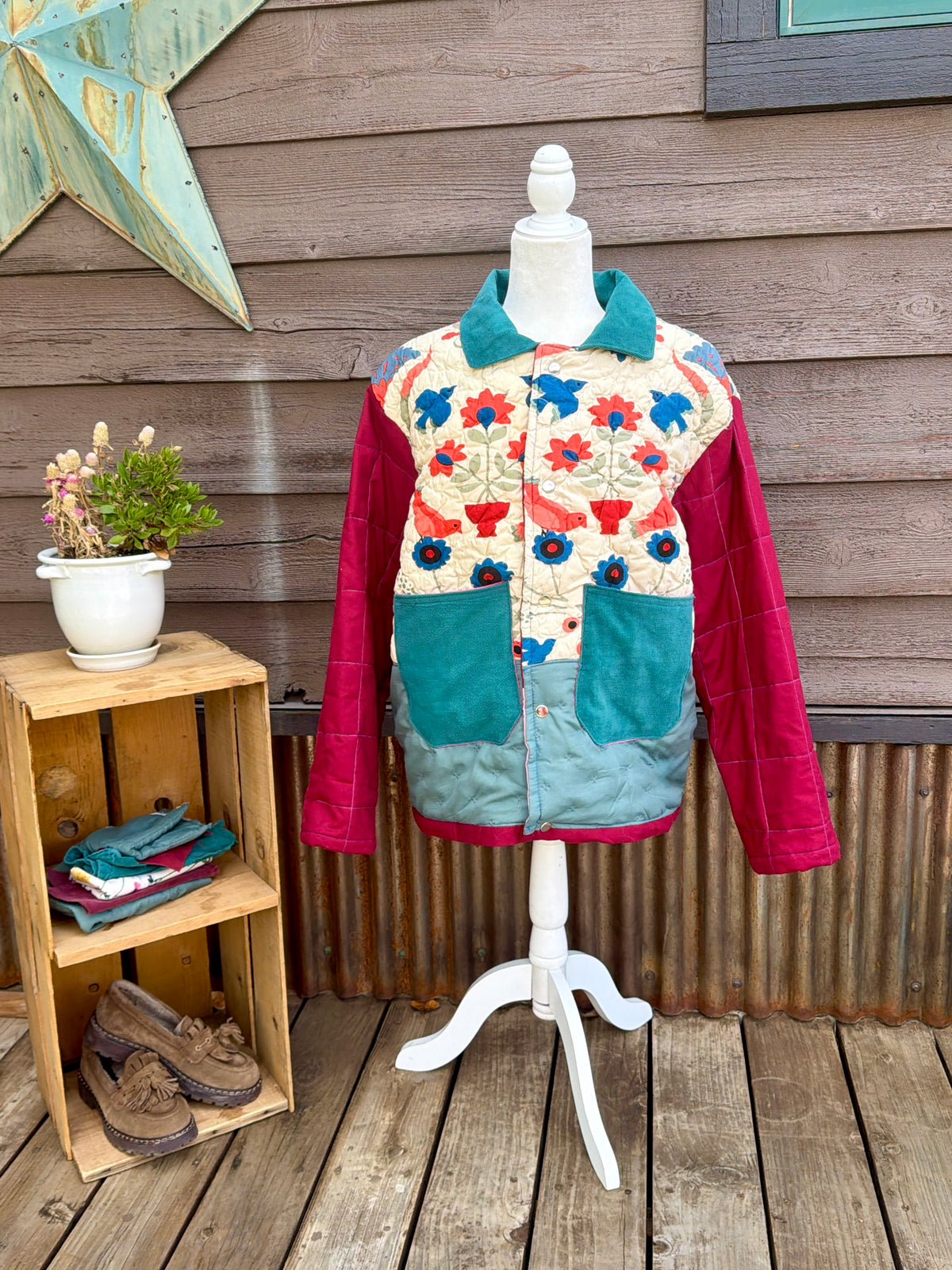 Cream and seafoam floral bedspread camp coat on a mannequin, front view