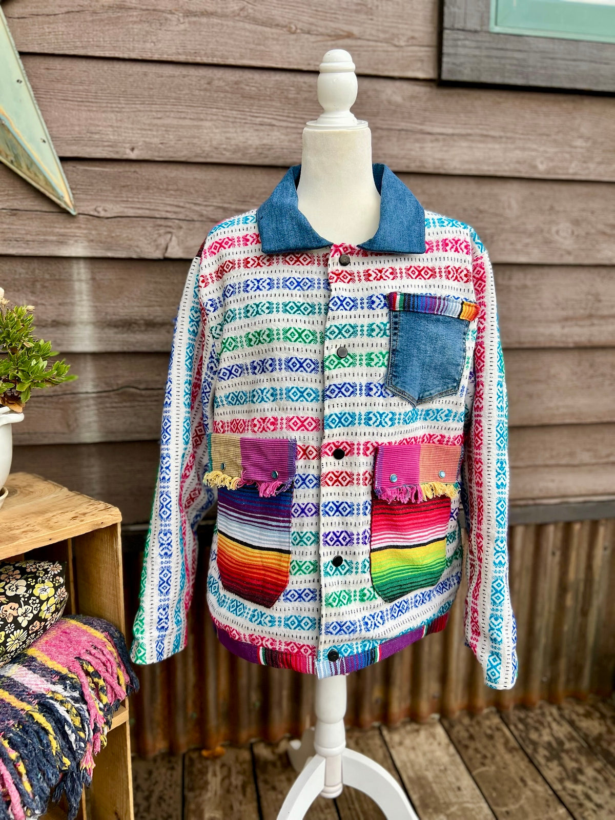 Front view of handmade bold multicolor woven stripe blanket on the multicolor woven stripe blanket camp coat