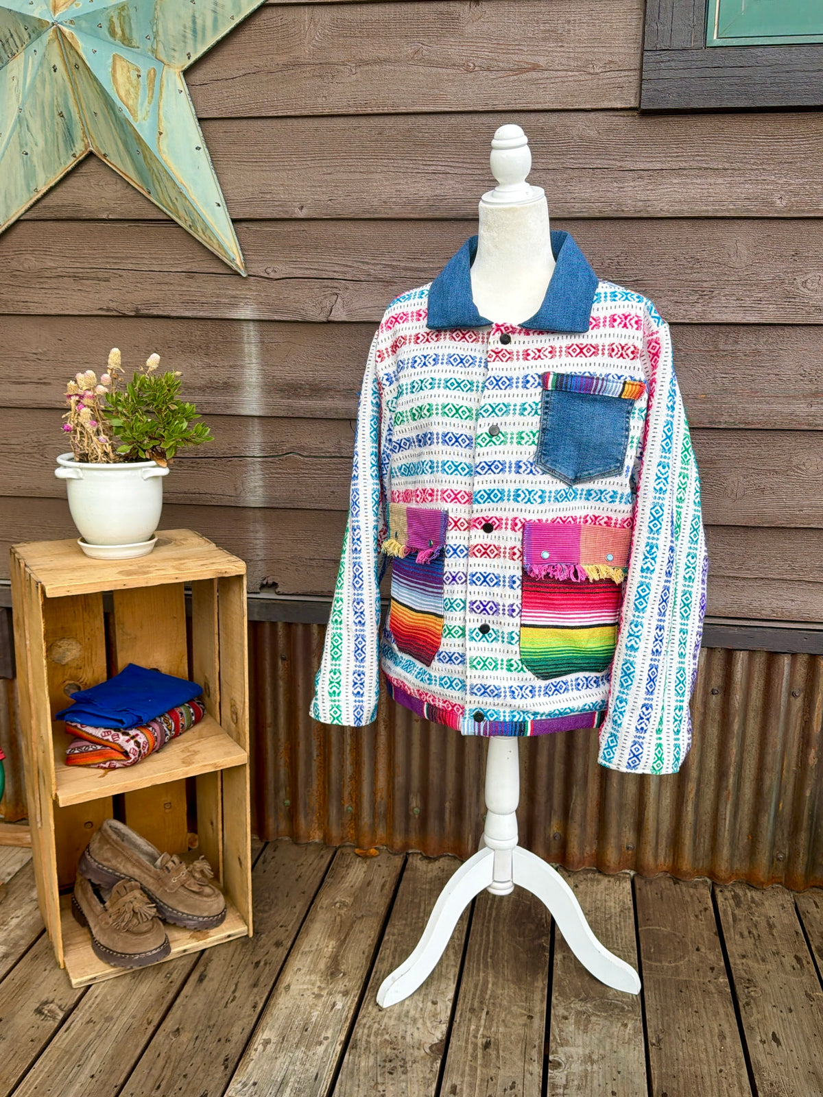 Multicolor woven stripe blanket camp coat on a mannequin, front view