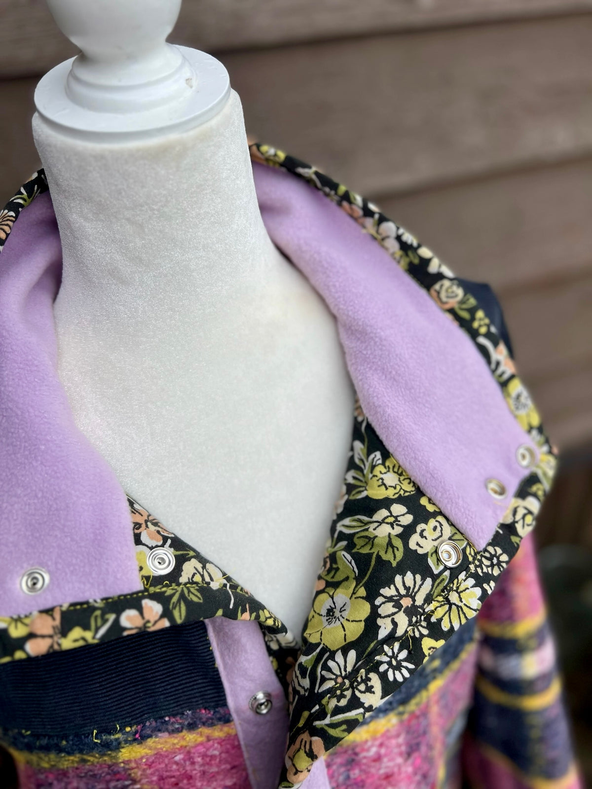 Inside of the pink plaid wool blanket boxy chore coat showing the floral sheet lining