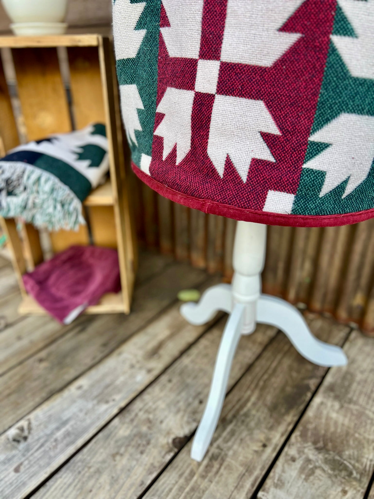 Close-up of the burgundy corduroy upcycled pants hem bias on the Southwestern blanket camp coat with burgundy corduroy