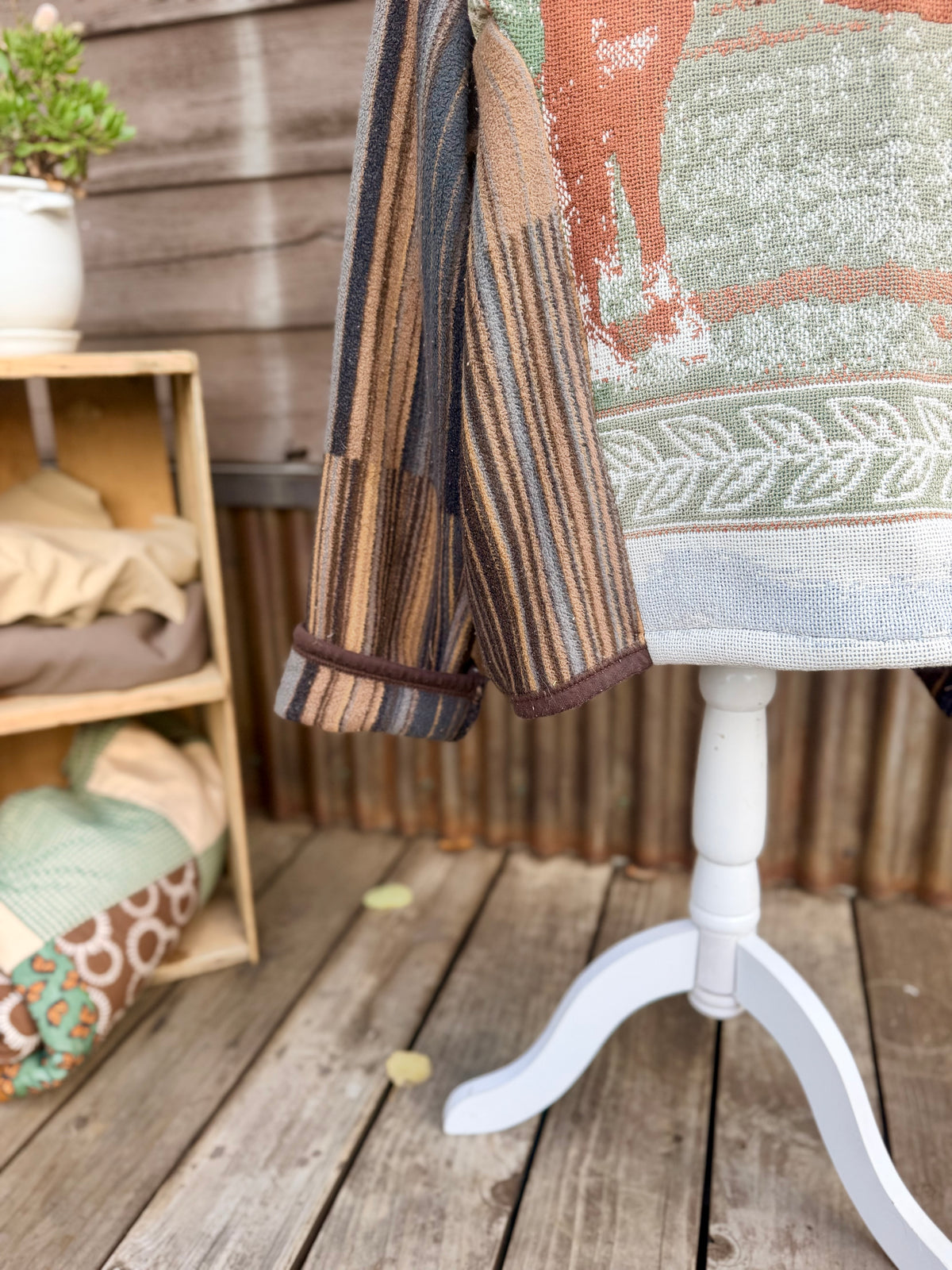  Striped horse blanket hooded coat on a mannequin, sleeve hem view