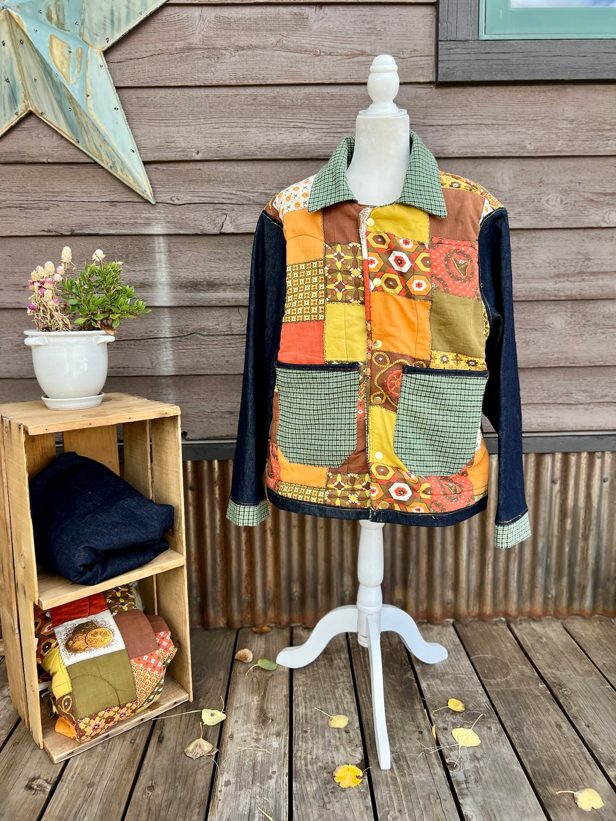 Vintage sleeping bag camp coat in yellow, brown and orange on a mannequin, front view
