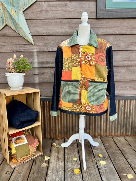 Vintage sleeping bag camp coat in yellow, brown and orange on a mannequin, front view