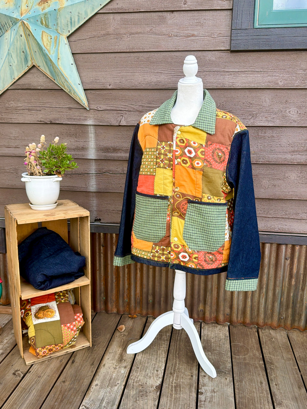 Vintage sleeping bag camp coat in yellow, brown and orange on a mannequin, front side view
