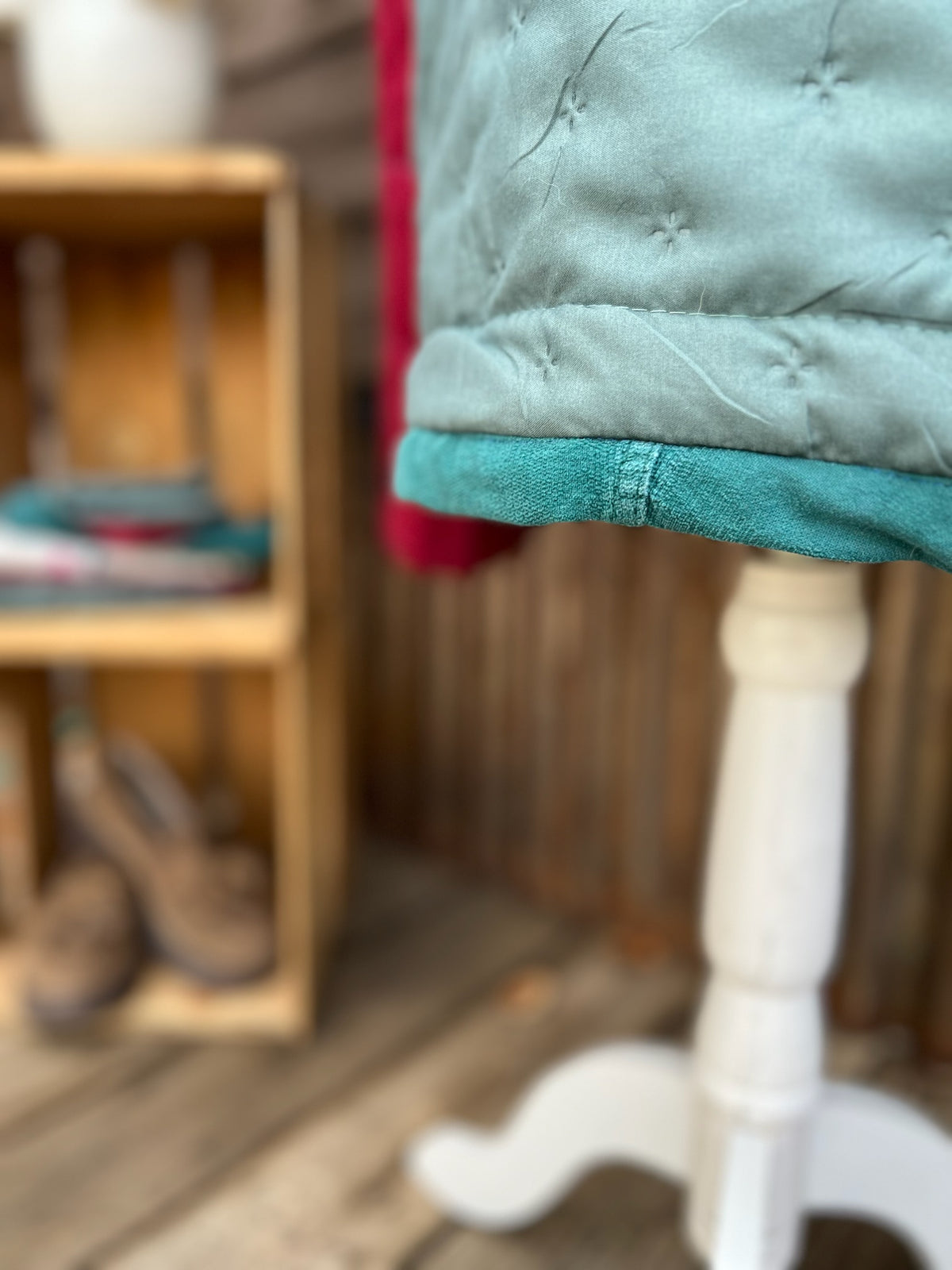 Close up of upcycled pants made into bias hem on quilted jacket