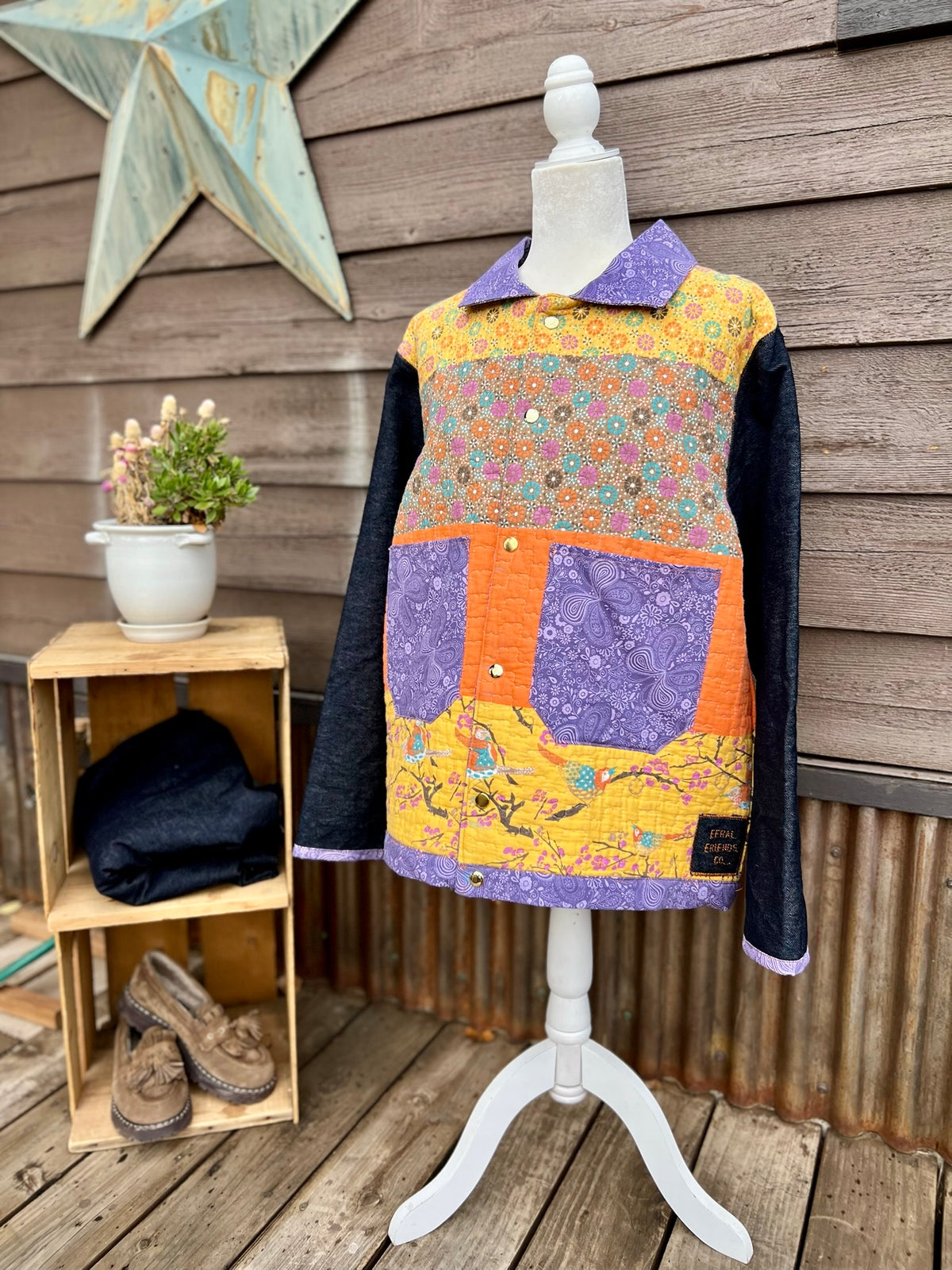 Yellow quilt camp coat with denim sleeves on a mannequin, side view