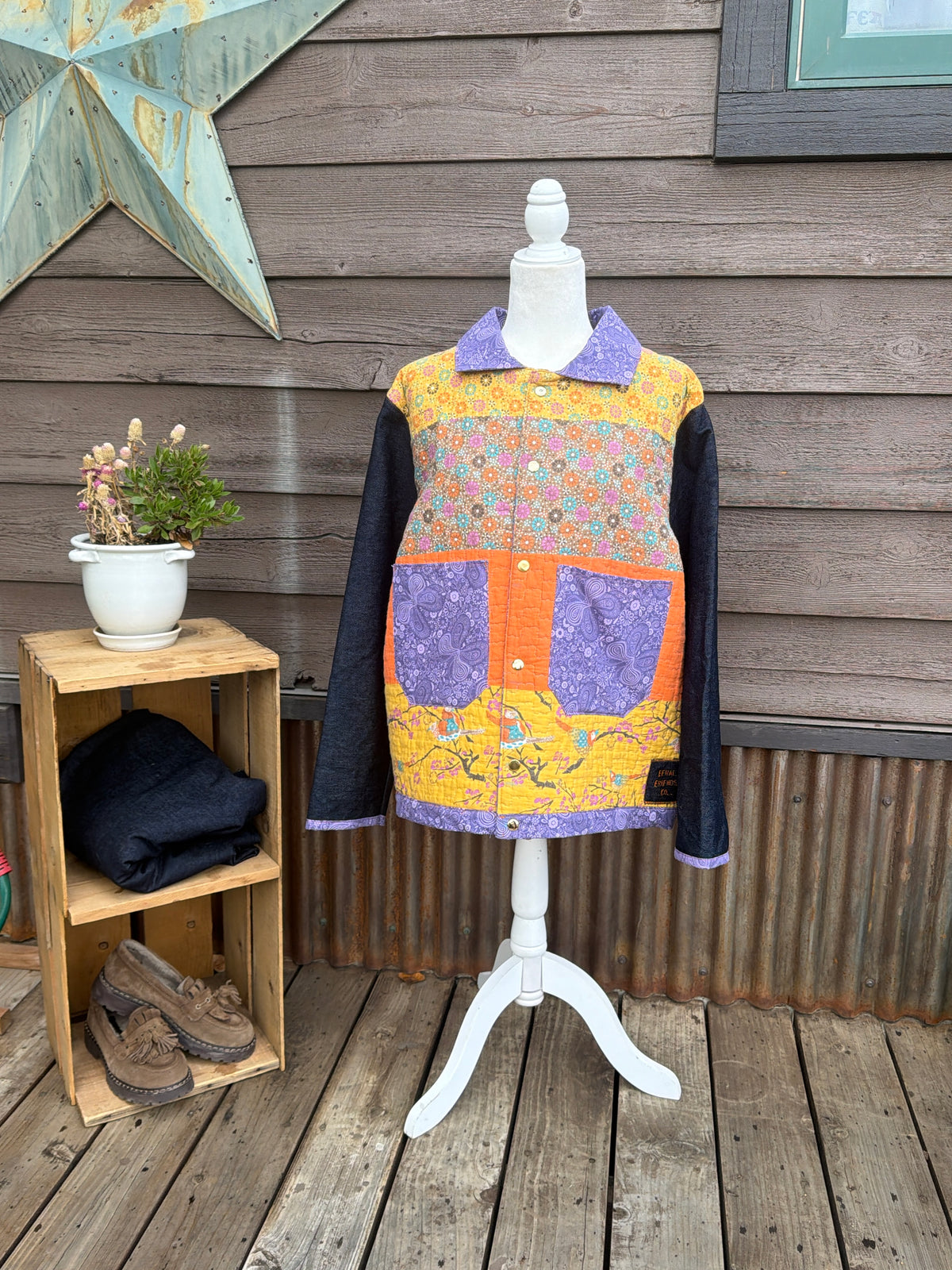 Yellow quilt camp coat with denim sleeves on a mannequin, front view