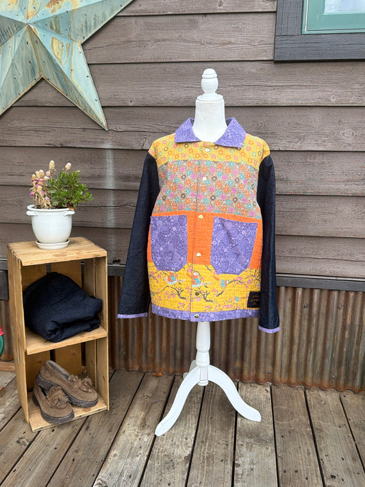Yellow quilt camp coat with denim sleeves on a mannequin, front view